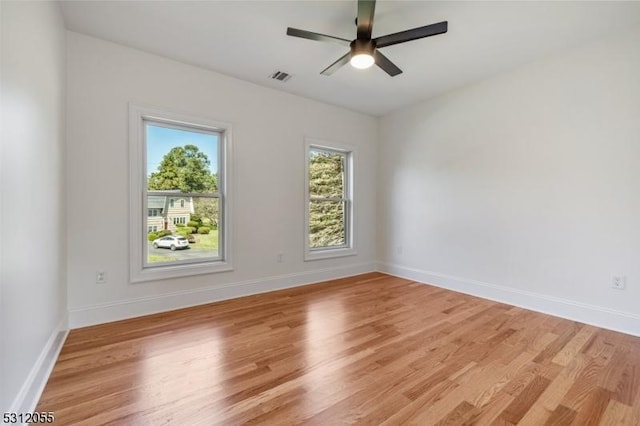 empty room featuring ceiling fan and light wood-type flooring