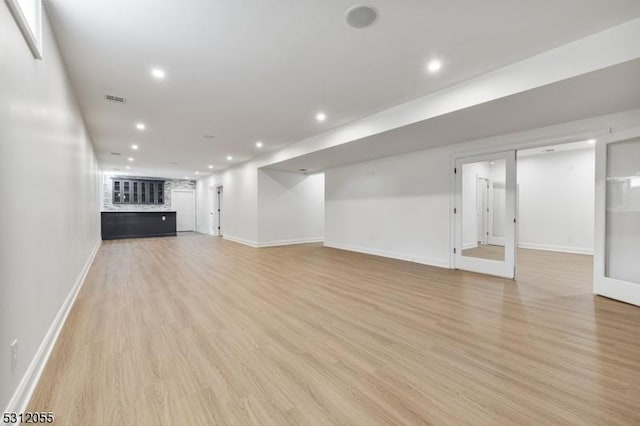 basement with light wood-type flooring