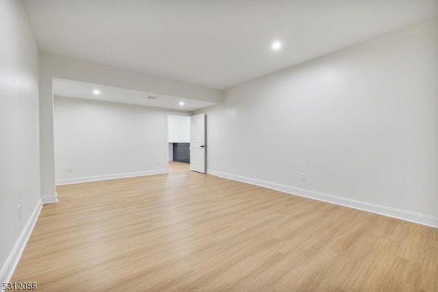 spare room featuring light hardwood / wood-style flooring