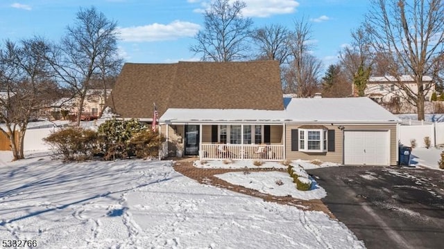 view of front of property featuring a porch and a garage