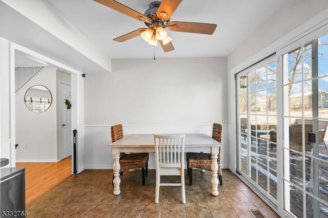 dining space with tile patterned floors, ceiling fan, and breakfast area