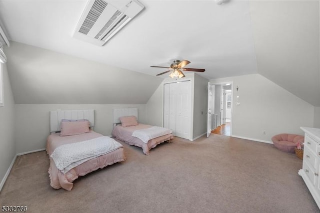 carpeted bedroom with lofted ceiling, ceiling fan, and a closet