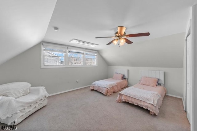 carpeted bedroom with lofted ceiling and ceiling fan