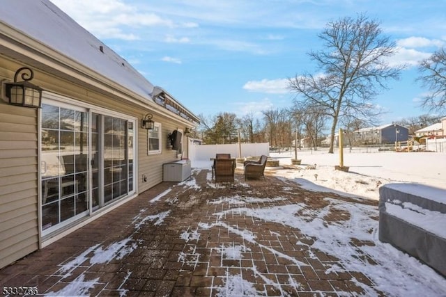 view of snow covered patio