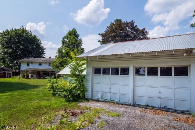 garage with a yard