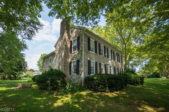 view of home's exterior with a lawn