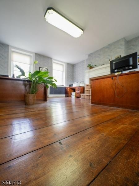 unfurnished dining area with dark hardwood / wood-style floors