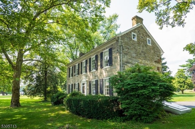 view of home's exterior featuring a yard