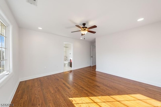 unfurnished room with hardwood / wood-style flooring, a wealth of natural light, and ceiling fan