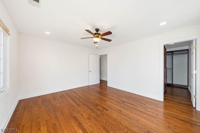 empty room featuring ceiling fan and hardwood / wood-style flooring