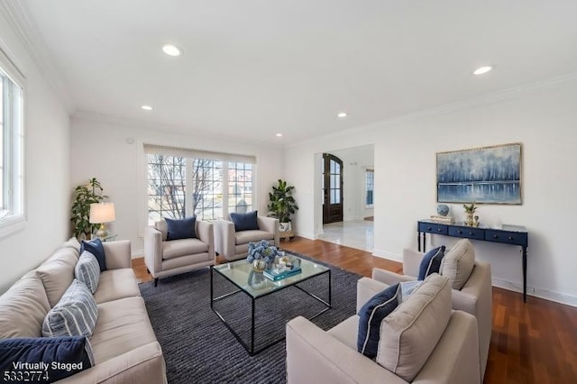 living room with hardwood / wood-style floors and crown molding