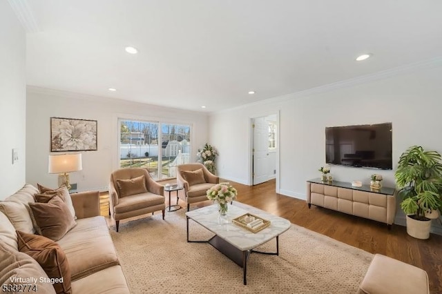 living room featuring wood-type flooring and crown molding