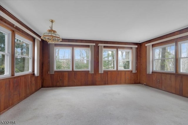 unfurnished sunroom with a chandelier