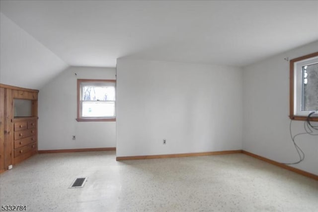 bonus room featuring vaulted ceiling