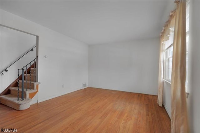 spare room featuring light hardwood / wood-style flooring