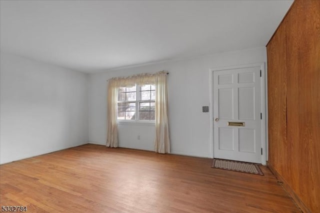 unfurnished room with light wood-type flooring