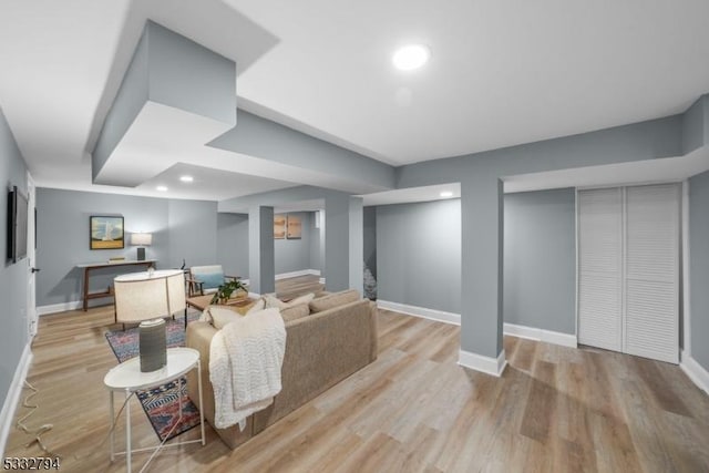 living room with light hardwood / wood-style flooring