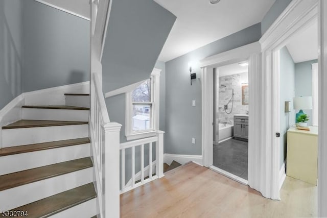 stairs with hardwood / wood-style floors