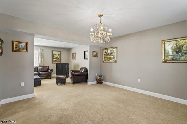 sitting room featuring a chandelier and light colored carpet