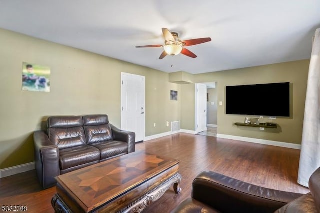 living room with ceiling fan and wood-type flooring