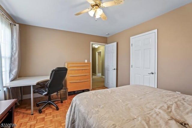 bedroom featuring ceiling fan and light parquet floors