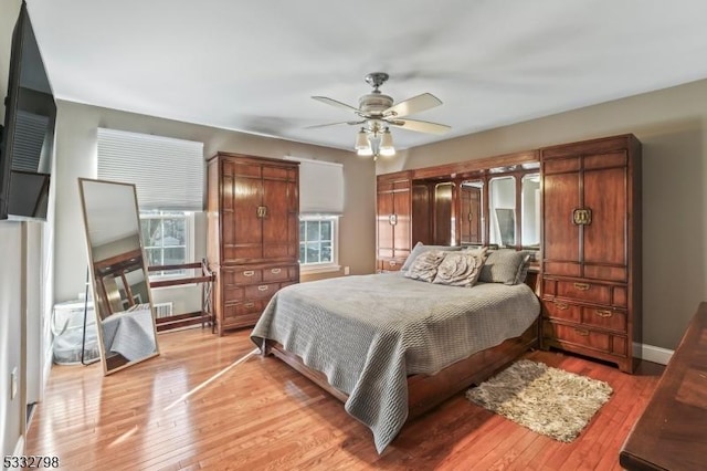 bedroom featuring ceiling fan and light hardwood / wood-style floors