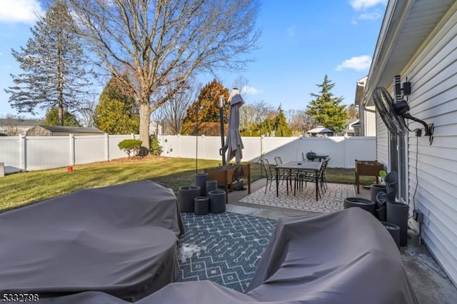 view of patio featuring a grill