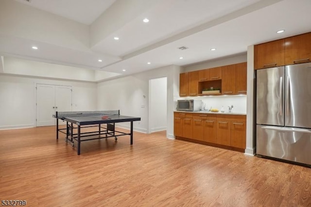 rec room with light hardwood / wood-style flooring