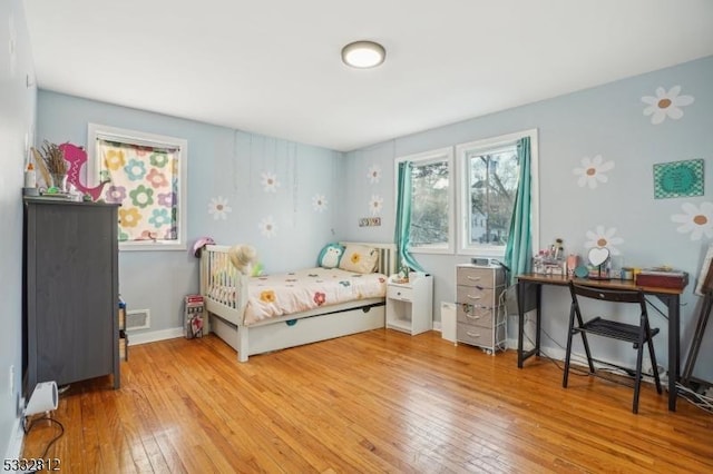 bedroom with light wood-type flooring