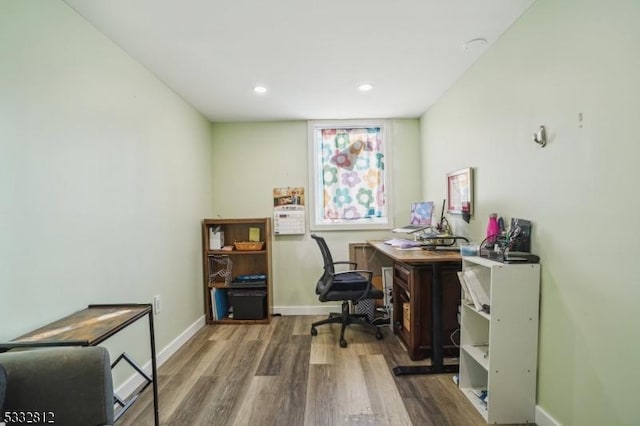 office area with hardwood / wood-style floors