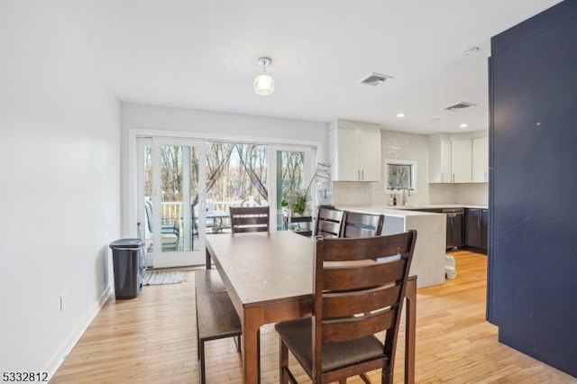 dining room featuring light wood-type flooring