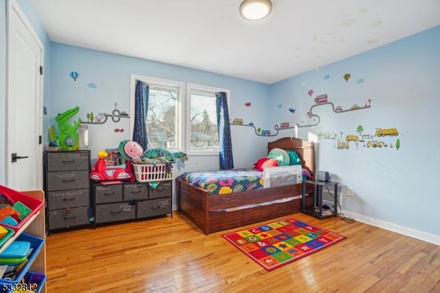 bedroom with light hardwood / wood-style floors