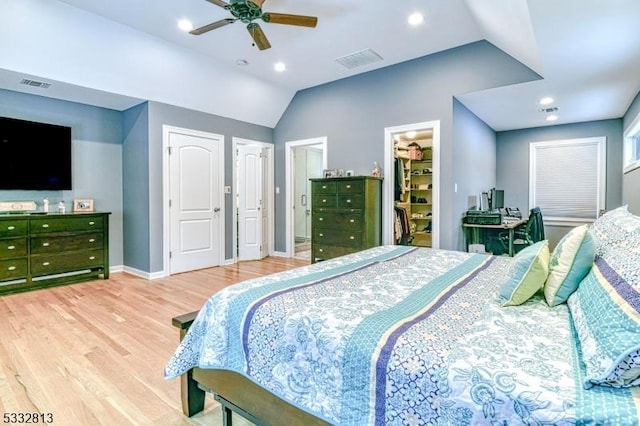 bedroom featuring ceiling fan, lofted ceiling, and wood-type flooring