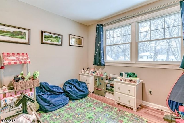 playroom featuring light hardwood / wood-style floors