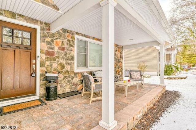 view of snow covered property entrance