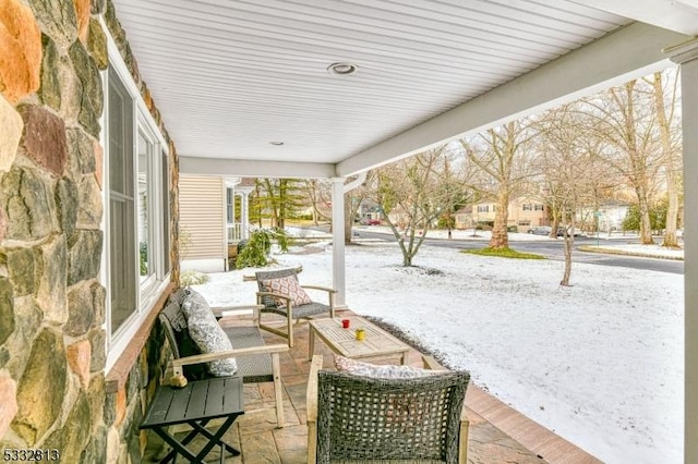 view of snow covered patio