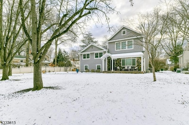 view of snow covered house