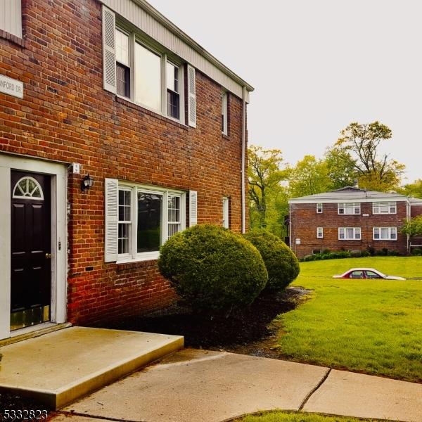 view of property exterior with a lawn