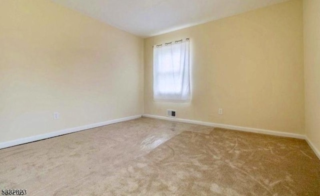 unfurnished room with carpet floors