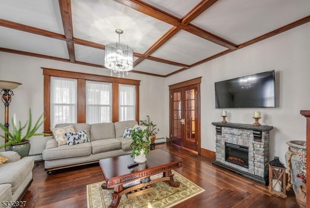 living room with baseboard heating, a fireplace, an inviting chandelier, dark hardwood / wood-style floors, and coffered ceiling