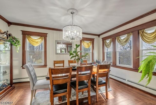 dining area featuring a baseboard radiator, a healthy amount of sunlight, a chandelier, and parquet flooring