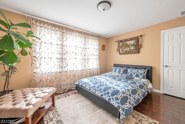 bedroom featuring dark hardwood / wood-style floors