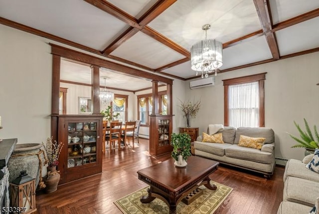 living room featuring an inviting chandelier, ornate columns, coffered ceiling, a wall unit AC, and a baseboard heating unit