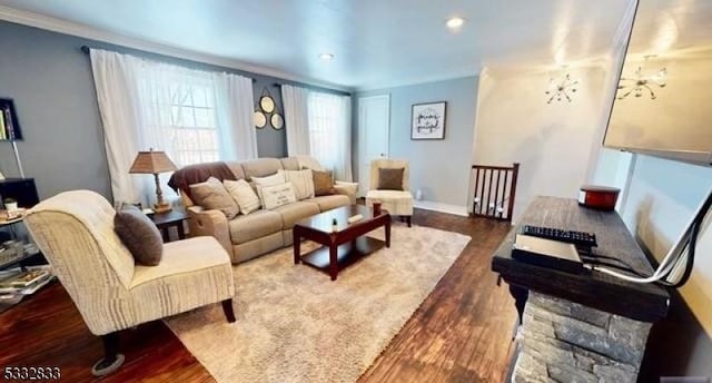 living room with crown molding and dark hardwood / wood-style floors