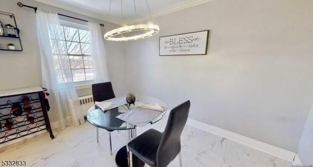 dining room featuring crown molding and a notable chandelier