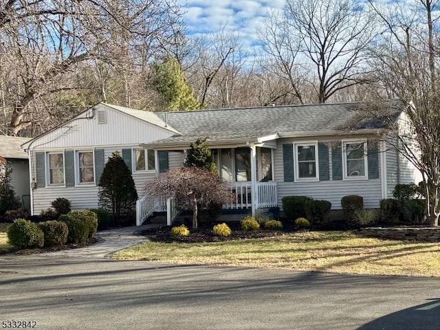 ranch-style home with a front lawn