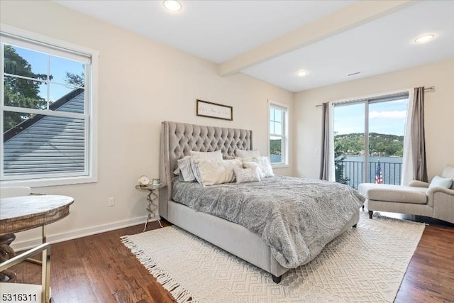 bedroom with beam ceiling, dark wood-type flooring, and access to exterior