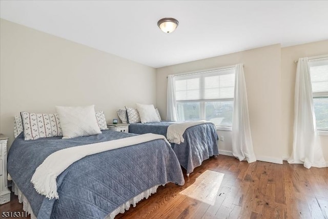 bedroom with hardwood / wood-style floors