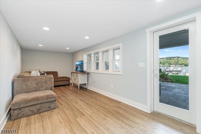 sitting room featuring light hardwood / wood-style flooring