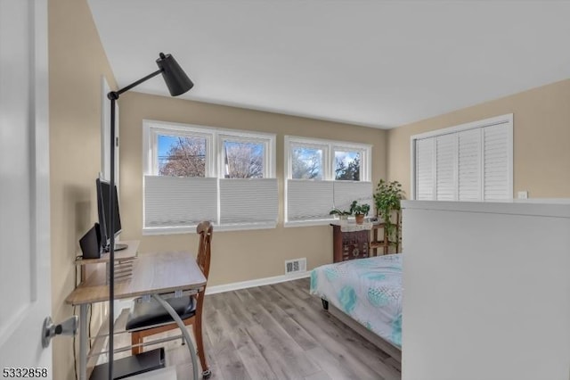 bedroom with light wood-type flooring